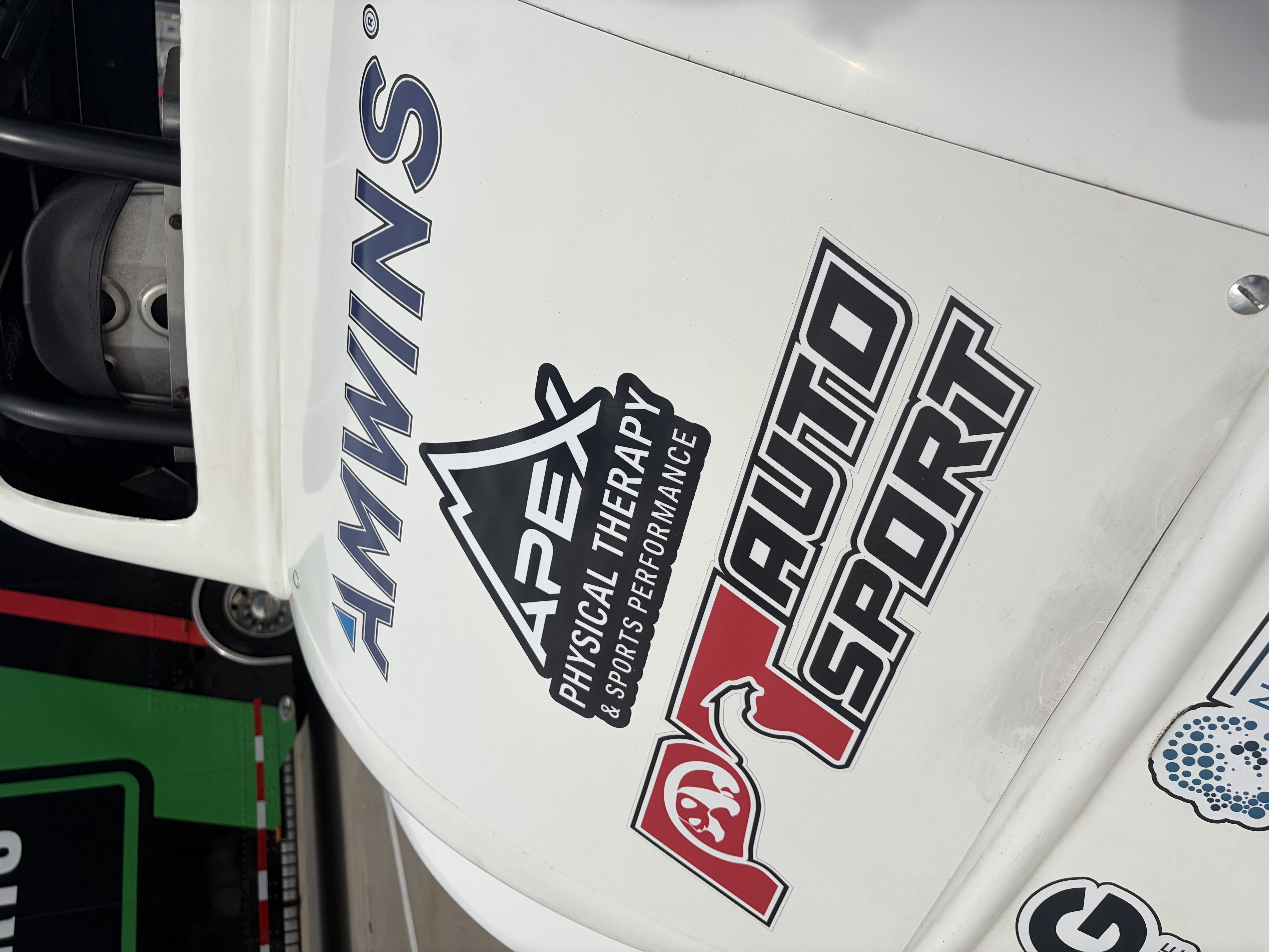 Sponsor decals on the car hood: AMWINS, APEX Physical Therapy, PT Auto Sport