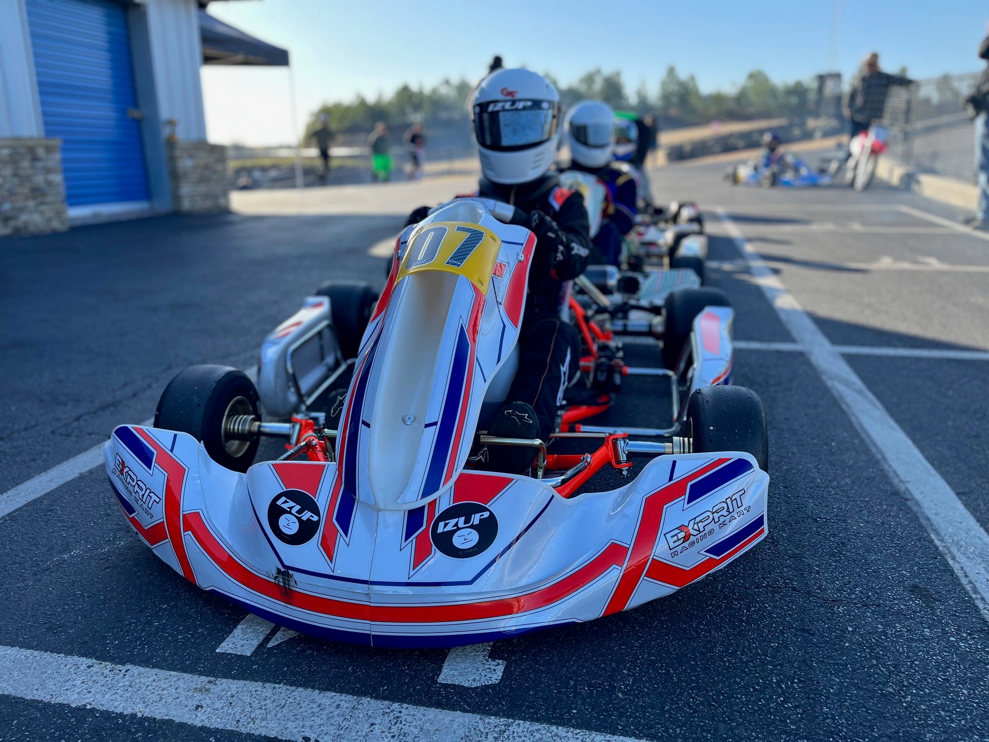 Close-up of Hayden's No. 07 kart lined up on track with teammates behind